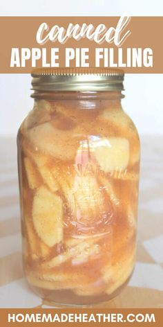 canned apple pie filling in a mason jar with text overlay that reads canned apple pie filling