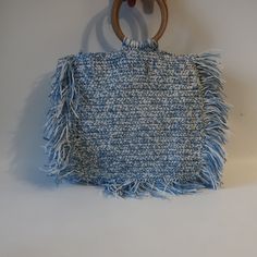 Nwt Womens Tina Demel Blue Azure White Wood Handle Woven Fringe Handbag * Retail: $250 Color: Blue, White Magnetic Closure 1- Interior Zipper Pocket Woven Fringed Wooden Handle Material: No Tag Feels Like Man-Made Material Measurements: Depth: 3.4" Height W/ Fringe: 12.5" Height: 10.7" Width W/Fringe: 15.7" Width: 11" Handle Drop: 3.7" New With Tags. ... (Bag- 999) Tna_rslyn_dad622- 4** Blue Top Handle Straw Bag For Everyday Use, Blue Top Handle Straw Bag For Shopping, Blue Rectangular Crochet Bag For Spring, Blue Top Handle Straw Bag For Summer, Blue Top Handle Shoulder Bag For Vacation, Blue Top Handle Shoulder Bag For Summer, Rectangular Blue Crochet Bag For Spring, Blue Square Straw Bag For Everyday Use, Light Blue Rectangular Shoulder Bag For Summer