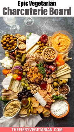 a wooden tray filled with different types of cheese and crackers on top of it