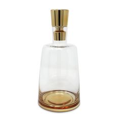 an empty glass bottle with a gold top