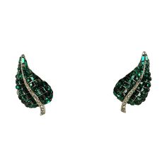 Elegant Ciner Invisibly Set Emerald Earrings with clip back fittings. Set with vari sized emerald pastes of different sizes throughout on rhodium metal. 1980's USA. 1.25" x .75". Green Metal Earrings For Evening, Green Metal Earrings For Formal Occasions, Formal Silver Clip-on Earrings With 17 Jewels, Green Brooch Jewelry For Evening, Green Metal Evening Earrings, Green Evening Brooch Jewelry, Green Clip-on Jewelry For Evening, Green Clip-on Earrings For Anniversary, Green Clip-on Earrings For Formal Occasions