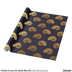 golden seashells on navy blue wrapping paper, by luxury design coutch