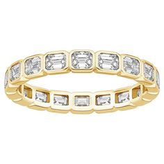 Ring Information Metal: 14k Gold, 18k Gold, Platinum Diamond Total Carat : 2ttcw Diamond Cut : Emerald Cut - Emerald Cut Natural Diamond Clarity: VS Diamond Color: F-G Color: White Gold, Yellow Gold, Rose Gold, Platinum Ring Size: 3-13 Lead Time: 4-8 Weeks (If out of Stock) JEWELRY CARE Over the course of time, body oil and skin products can collect on Jewelry and leave a residue which can occlude stones. To keep your Jewelry looking bright and new, take a soft headed toothbrush with some mild soap and gently brush the front and back of the stones and metal. Rinse thoroughly with tepid water. We do not suggest putting Jewelry in an ultrasonic to clean. Steam cleaning works well, but do not steam emeralds or opals as high heat can damage these stones. Diamond Band Rings, Emerald Cut Eternity Band, Sapphire And Diamond Band, Bezel Set Ring, Sapphire Band, American Modern, Platinum Jewelry, Vs Diamond, Modern Ring