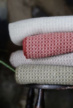 four towels stacked on top of each other