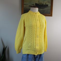 "Vintage mid-century cardigan sweater from the 1960s. Labeled size 36. Please see measurements for accurate fit.  Measurements (taken laid flat, doubled where necessary): Length: 23.5\" Shoulders: 16\" Chest: 36\" Sleeve length: 21\" Mannequin is a size Small and measures 34,27,34. Height 5'6\" Condition: Good vintage condition. PILLING noted (pictured). No other notable signs of wear. Thank you for visiting Bug B. v i s i t t h e s h o p www.BugBVintage.etsy.com" Retro Sweater With Button Closure For Spring, Retro Spring Sweater With Button Closure, Retro Yellow Cardigan For Spring, Retro Button-up Spring Sweater, Fitted Vintage Sweater With Buttons, Vintage Spring Sweater With Buttons, Vintage Long Sleeve Sweater With Buttons, Yellow Retro Cardigan For Spring, Vintage Fitted Sweater With Buttons