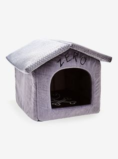 a gray dog house with the word zero written on it's front and side