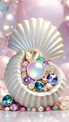 an image of a shell with pearls and jewels on it