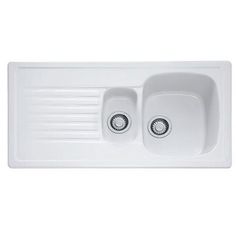 a white kitchen sink with two faucets on the left and right drainers