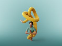 a man standing in front of a banana shaped like a snake with his arms stretched out