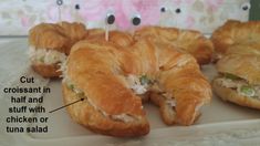 several croissants with toothpicks sticking out of them on a plate