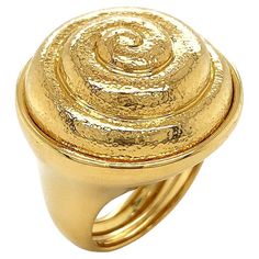 18k yellow gold sparkles with brilliancy in this ring. The bezel is a raised coil, inspired by the shell of a snail. The spiral is textured for a lustrous glow, while the groove itself is polished to match the band of the ring. Measurements for the ring are 0.92 inches (width) by 1.15 inches (length) by 0.9 inches (depth). Spiral Shell, The Spiral, Domed Ring, Gold Sparkle, Gold Texture, Jewelry Rings, Sparkle, Yellow Gold, Texture