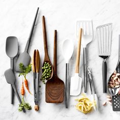 the kitchen utensils are laid out on the counter top, with various ingredients in them