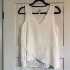 White, V Neck Sleeveless Top, Size S. New Without Tags. Sleeveless Summer Tank Top For Layering, Sleeveless Tops For Day Out, Sleeveless Summer Tops For Layering, Summer Sleeveless Tops For Layering, Spring Sleeveless Layering Camisole, Spring Sleeveless Camisole, Summer Sleeveless Camisole For Layering, Sleeveless Summer Camisole For Layering, Sleeveless Layering Camisole For Summer