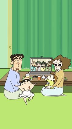 a family sitting on the floor in front of a tv screen with an adult and child watching