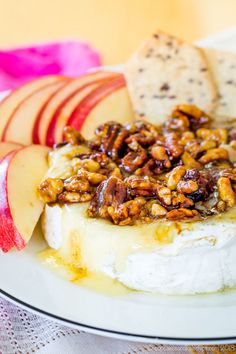 a plate topped with cheese covered in nuts