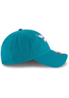 This Charlotte Hornets Teal Adjustable Hat features a front embroidered team logo on a lightly-structured cotton crown, with pre-curved visor and adjustable backstrap. Team logo embroidered on the front, Cloth Strap Closure to dial in the perfect fit, Relaxed, unstructured fit, Pre-curved bill, 100% cotton construction, New Era Flag logo on side, Dad hat, 100% Cotton, Washable, Imported Blue Cotton Sports Hat, Blue Cotton Hat For Sports Events, Cotton Hat With Team Logo For Sports Events, Cotton Sports Hat With Team Logo, Team-colored Cotton Hats With Curved Brim, Team-colored Cotton Hat With Embroidered Logo, Cotton Cap For Fan Gear, Cotton Cap For Fan Merchandise, Cotton Fan Merchandise Cap