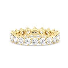 a yellow gold ring with white diamonds