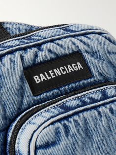 The compact shape of Balenciaga's 'Explorer' messenger bag makes it ideal for your errands or weekend adventures. Printed with the brand's emblem across the front, it's made from denim and has two zipped compartments. Change up the styling and wear it on both your front and back. Designer Travel Bags With Zipper Pocket, Blue Travel Bag With Logo Patch, Designer Bags With Logo Patch For Everyday Use, Casual Blue Bag With Logo Patch, Luxury Shoulder Bag With Logo Patch For Travel, Blue Luxury Bag With Pockets, Casual Blue Bags With Logo Patch, Luxury Blue Bags With Pockets, Crossbody Travel Bag With Logo Patch