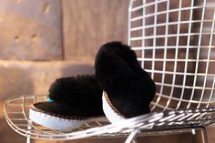 Available in plain black our traditional handmade slippers are made from 100% natural sheepskin and display a soft woollen interior and fluffy sheepskin cuff. The pleasant interior is made of natural wool, which keeps you warm on cold days, and regulates the temperature on hot days and prevents overheating.   Sheepers slippers are handmade therefore, some variations can occur and they are only to be worn indoors. Sheepskin and leather is a natural material so they will naturally flatten with wea Black Moccasins, Handmade Moccasins, Sheepskin Gloves, Best Slippers, Winter Leather Boots, Warm Shoes, Black Slippers, Handmade Slippers, Sheepskin Slippers