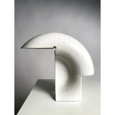 a white sculpture sitting on top of a table