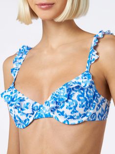 Woman bralette swimsuit with rufflesBluette patterns on white backgroundComposition:90% polyamide 10% elastane Fitted Underwire Swimwear With Ruffles, Fitted Underwire Ruffle Swimwear, Fitted Ruffled Underwire Swimwear, Beachwear Swimwear With Adjustable Ruffled Straps, White Ruffled Straps Swimwear For Poolside, Summer Swimwear With Ruffles And Underwire, Ruffled Straps Swimwear For Sunbathing, Blue Swimwear With Ruffled Straps For Poolside, Blue Swimwear With Ruffled Straps