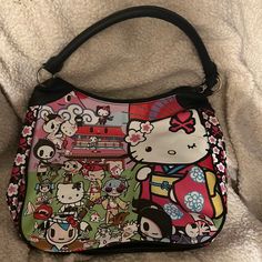 Tokidoki Hello Kitty Sanrio Purse Bag, Large Size, Simulated Leather Material, Adorable Tokidoki Hello Kitty Design Printed On Front, Black Back With Tokidoki-Hello Kitty Logo Patch, Excellent Condition, Discontinued, Rare, And Hard To Find! Mcbling Clothing, Sanrio Purse, Tokidoki Bag, Cute Hand Bags, Hello Kitty Design, Hello Kitty Bags, Hello Kitty Gifts, Hello Kitty Purse, Hello Kitty Merchandise