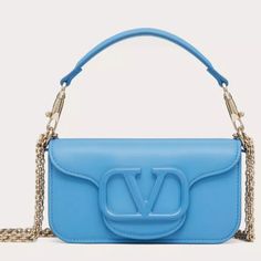 Blue Valentino Garavani Crossbody Bag Blue Double Handle Shoulder Bag For Evening, Blue Top Handle Shoulder Bag For Evening, Blue Evening Shoulder Bag With Top Handle, Designer Light Blue Shoulder Bag For Evening, Luxury Light Blue Shoulder Bag For Formal Occasions, Blue Shoulder Bag With Removable Pouch For Evening, Designer Light Blue Formal Bags, Blue Tote Shoulder Bag For Evening, Evening Light Blue Shoulder Bag With Detachable Strap