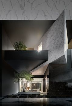 the interior of a modern house with black and white marble