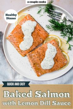 baked salmon with lemon dill sauce on a white plate