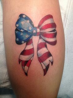 an american flag bow tattoo on the leg