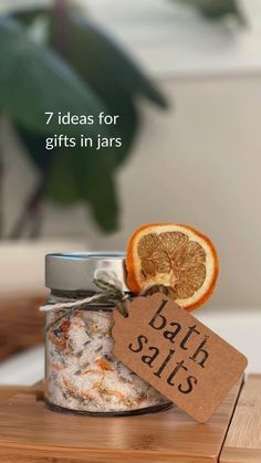 an orange slice sitting on top of a jar with bath salts in it and a tag that says 7 ideas for gifts in jars