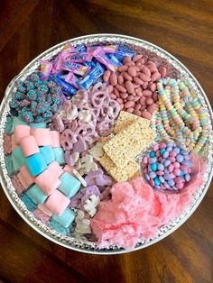 a bowl filled with lots of different types of candy