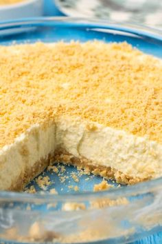 a close up of a cake in a glass pie dish with one slice cut out