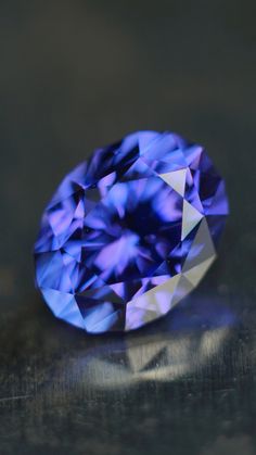 a blue diamond sitting on top of a table