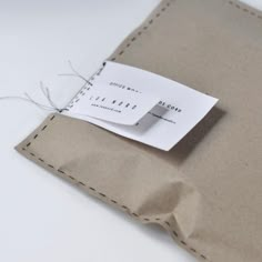 a piece of paper with a tag attached to it