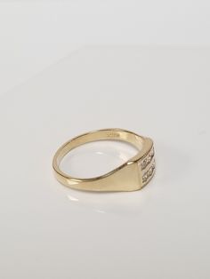 "Thanks for shopping our vintage estate store. We tend to sell well below wholesale and truly hope you enjoy all of our items. Many of the items are one of a kind, so please enjoy scrolling through the pictures and hopefully something will catch your eye. Brown spots are from camera or reflections. Estate 10k yellow gold .10ct cz diamond midi or pinky ring. There are 6 small cz diamonds in the setting. Ring size: 3 Inside ring: 14.5mm Setting: 5.5mm 1/4\" Band width: 2mm Weight: 1.12 grams Very Vintage Signet Ring With Diamond Accents For Formal Occasions, Vintage Signet Ring With Diamond Accents For Formal Events, Vintage Formal Signet Ring With Diamond Accents, Vintage Diamond Birthstone Ring, Hallmarked, Vintage Diamond Birthstone Ring Hallmarked, Classic Gold Diamond Signet Ring, Antique Gold Diamond Signet Ring, Vintage Gold Diamond Ring With Vvs Clarity, Classic 14k Gold Signet Ring With Diamond Accents