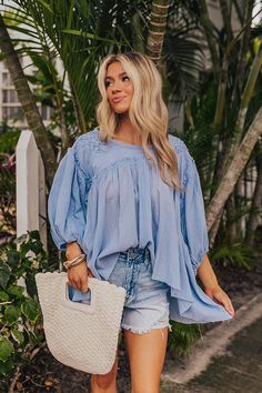 - Keep it simple and cute with this flowy top! - Unlined material with crochet accents - A round neckline - Loose ¾ length sleeves with elastic cuffs - A flowy babydoll silhouette that ends in a straight hemline Flowy Top, Babydoll Top, Flowy Tops, Keep It Simple, Round Neckline, Sky Blue, Blue Sky, Baby Dolls, Length Sleeve