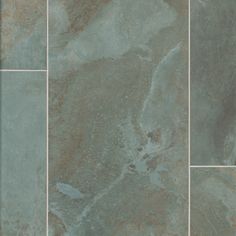 a tile floor with different shades of green and brown on the top one is gray