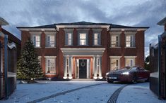 a red car parked in front of a large brick house with snow on the ground