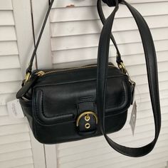 This Bag Is Brand New With Tag Attached It Is Style Number F25150 Leather Crossbody Camera Bag Original Retail $258 It Has A Flap In Front With Magnetic Snap Closure, It Has A Zip Top Opening With An Inner Zip Pocket And Two Open Side Pockets. Dimensions Are Approx 8.5 X 5 X 4 With Strap Drop Length Of 25 In Black Box Bag With Branded Hardware For Travel, Classic Square Shoulder Bag With Branded Hardware, Classic Black Flap Bag For Shopping, Classic Crossbody Shoulder Bag With Branded Hardware, Black Flap Bag With Branded Hardware For Shopping, Evening Camera Bag With Removable Pouch, Evening Black Leather Camera Bag, Classic Satchel Box Bag With Branded Hardware, Classic Crossbody Box Bag With Branded Hardware