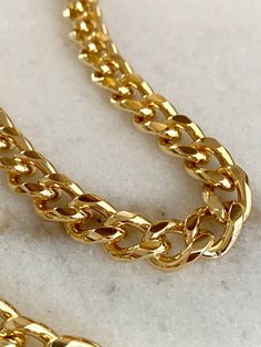 Amazing sturdy gold chain made in the USA. Matching jump rings and lobster claws available. Material: Gold tone fashion chain  Link Size: 13mm long X 9.5mm wide X 2.5mm thick  Length: This listing is for a 1 foot long chain Color: Gold Tone Convo me for additional chain #004 Cut to order chains will only be available for exchange. The actual colors may vary slightly from those shown depending on the device you are using to view the product. Shop our other chains: https://www.etsy.com/shop/bysupply?ref=seller-platform-mcnav&section_id=10849391 Gold Link Chain Bracelet With Lobster Clasp, Gold Oval Link Figaro Chain Bracelet, Gold Figaro Chain Bracelet With Oval Links, Cuban Link Necklace With Lobster Clasp, Gold Chain Bracelet With Chain Strap As Gift, Gold Link Chain Necklace With Lobster Clasp, Gold-plated Cuban Link Necklace, Gold Cuban Link Necklace With Adjustable Chain, Gold Cuban Link Necklace With Chunky Chain