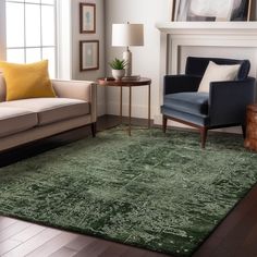 a living room filled with furniture and a green rug on top of a hard wood floor