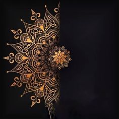 an intricate golden flower on a black background