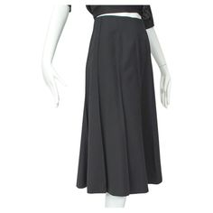 In seasonless wool gabardine, this wardrobe workhorse features a universally-flattering flared trumpet silhouette and ten ridged gores for an exceptional 7.5 foot swing. Literally a wear-with-anything staple you will never tire of. Swirling trumpet skirt with ten seamed gores around full circumference of skirt; no waistband. Minuscule left side zipper closure with two hooks and tabs inside waistband; fully lined in black viscose. fabric: wool gabardine, viscose noteworthy: dry clean only alterat Trumpet Silhouette, Trumpet Skirt, Viscose Fabric, Flare Skirt, Side Zipper, High Waisted Skirt, Midi Skirt, Dry Clean, Fashion Outfits