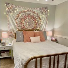 a bed room with a neatly made bed and a large tapestry hanging above the headboard