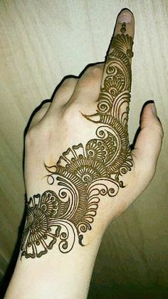 a henna tattoo on someone's hand