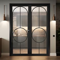 an open glass door leading into a kitchen with wooden flooring and brick wall in the background