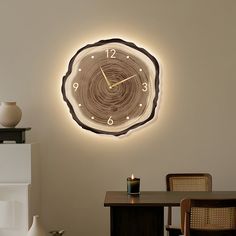 a clock that is on the wall above a table