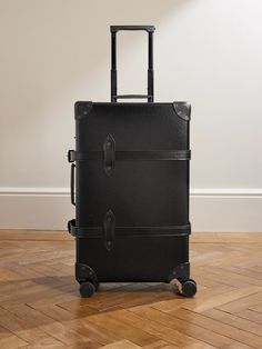 Globe-Trotter's luggage is a true lifetime investment. From the brand's 'Centenary' collection, this suitcase is made from the signature vulcanised fibreboard and trimmed with tonal leather. It's perfectly sized for a weekend away, with a spacious interior and organisational compartments. Classic Rectangular Cases For Overnight Trips, Classic Coated Canvas Luggage With Leather Handles, Classic Coated Canvas Luggage With Sleeve, Classic Luggage With Leather Trim For Business Trips, Classic Luggage With Leather Handles And Coated Canvas, Luxury Coated Canvas Luggage For Overnight Trips, Classic Coated Canvas Luggage For Overnight Trips, Classic Rectangular Luggage For Trip, Rectangular Travel Bag With Leather Lining