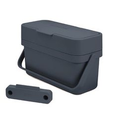 a gray lunch box with handle and strap